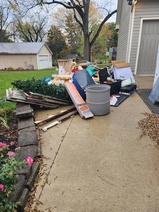 Dumpster being loaded with debris for Residential Dumpster Rental in Rosemont